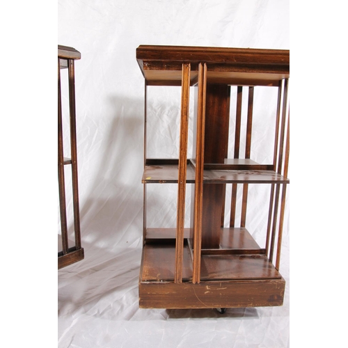 385 - Two Edwardian revolving bookcases with inlaid marquetry tops and slatted compartments, max H85cm.