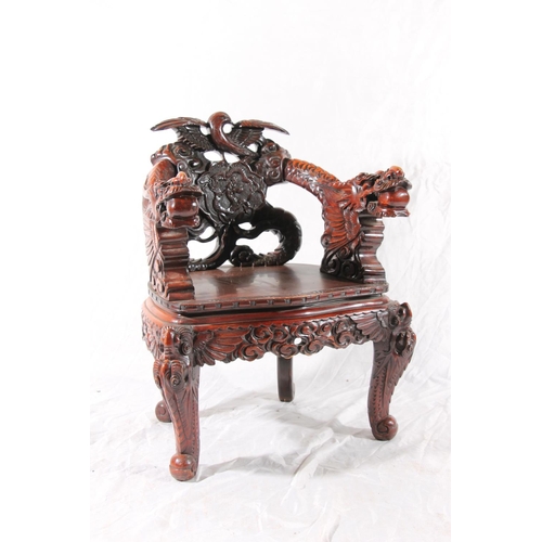 391 - Chinese export hardwood elbow chair, the eagle surmount crest leading to carved dragon splat, shaped... 