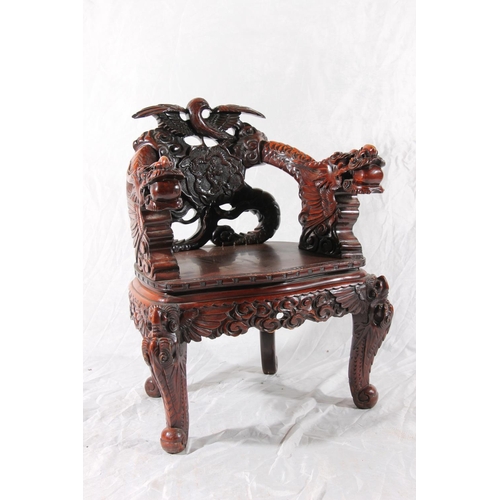 391 - Chinese export hardwood elbow chair, the eagle surmount crest leading to carved dragon splat, shaped... 