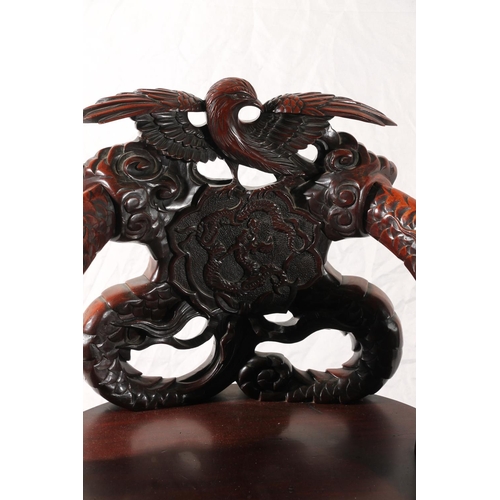 391 - Chinese export hardwood elbow chair, the eagle surmount crest leading to carved dragon splat, shaped... 