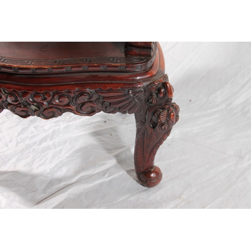 391 - Chinese export hardwood elbow chair, the eagle surmount crest leading to carved dragon splat, shaped... 