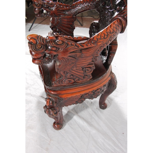 391 - Chinese export hardwood elbow chair, the eagle surmount crest leading to carved dragon splat, shaped... 