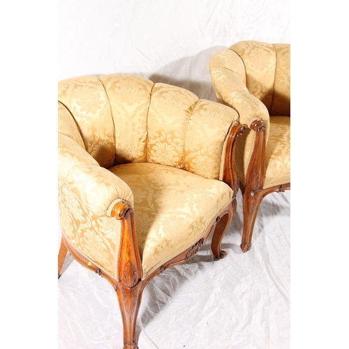 393 - Pair of Italian Art Deco walnut framed parlour tub chairs, shell form cushioned back over padded sea... 