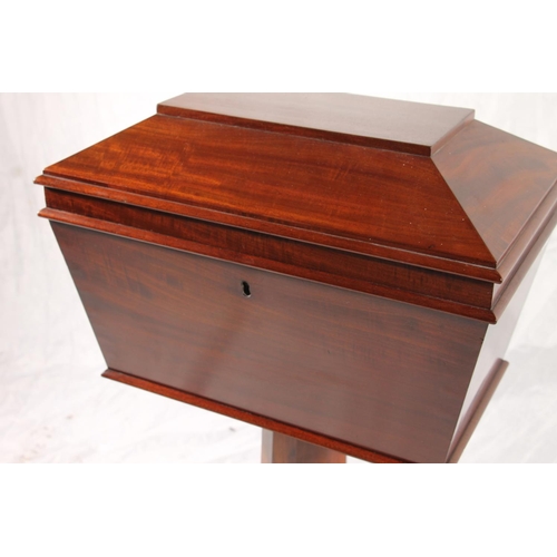 397 - Regency period mahogany tea poy, of sarcophagus shape with three fitted compartments, on fluted tape... 