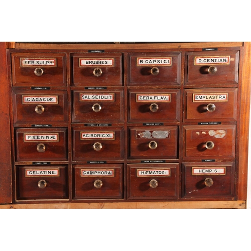 401 - Early 20thC apothecary chemists bank of drawers with original labels, later set into a mahogany and ... 