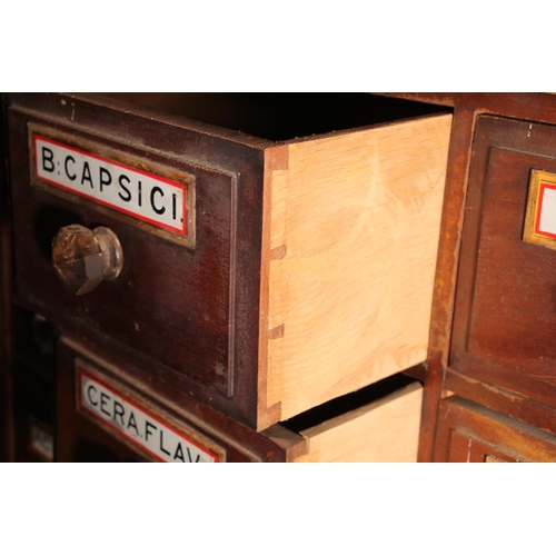 401 - Early 20thC apothecary chemists bank of drawers with original labels, later set into a mahogany and ... 