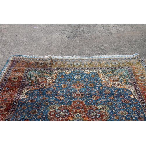 416 - Persian Kashan or Tabriz carpet, the blue ground with a central predominately red medallion, decorat... 