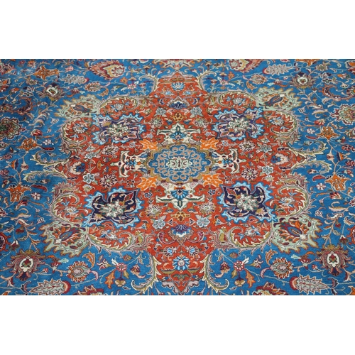 416 - Persian Kashan or Tabriz carpet, the blue ground with a central predominately red medallion, decorat... 