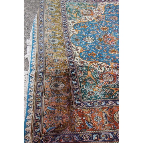 416 - Persian Kashan or Tabriz carpet, the blue ground with a central predominately red medallion, decorat... 