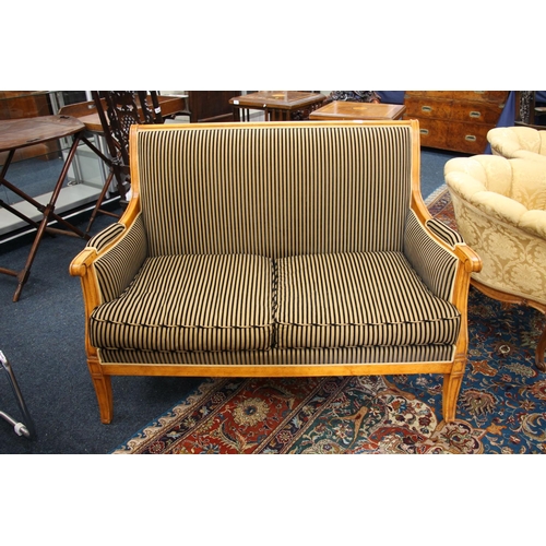 352 - Balzarotti of Paris, two seater parlour sofa, the shaped and moulded frame upholstered in a striped ... 