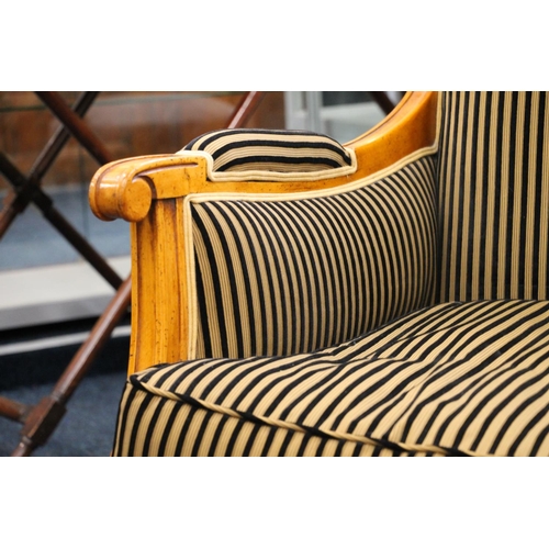 352 - Balzarotti of Paris, two seater parlour sofa, the shaped and moulded frame upholstered in a striped ... 