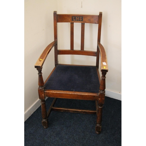 367 - 1920s oak LMS London Midland Scottish station armchair, H96cm.