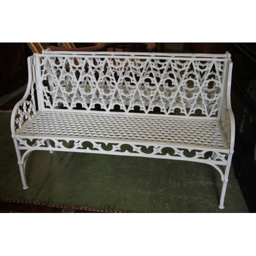 375 - Pair of white painted metal garden benches, with gothic fretwork back over honeycomb seat, armrests ... 