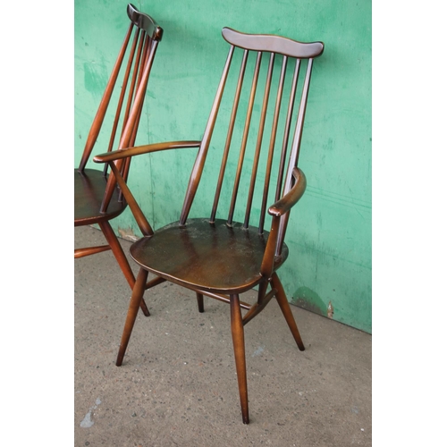 380 - Six Ercol Goldsmith windsor dining chairs with eight matching elbow chairs.