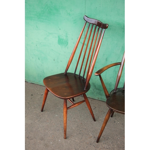 380 - Six Ercol Goldsmith windsor dining chairs with eight matching elbow chairs.