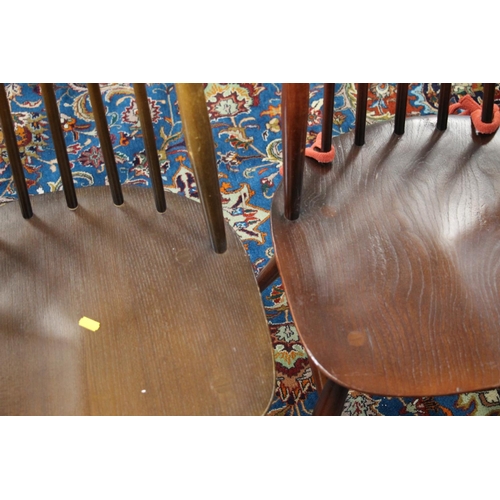 380 - Six Ercol Goldsmith windsor dining chairs with eight matching elbow chairs.