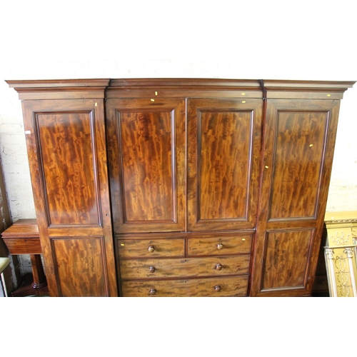 413 - Victorian mahogany inverted breakfront compactum, the moulded cornice over central doors with shelve... 