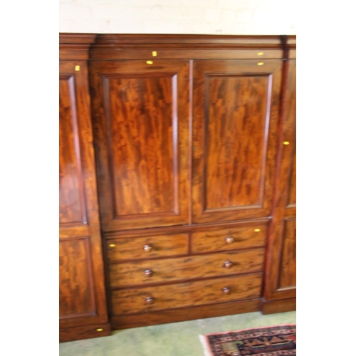 413 - Victorian mahogany inverted breakfront compactum, the moulded cornice over central doors with shelve... 