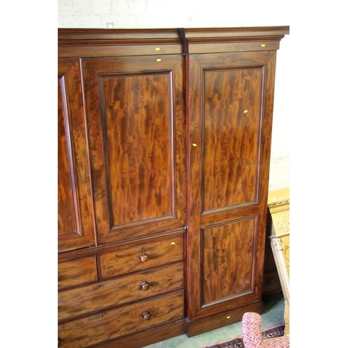 413 - Victorian mahogany inverted breakfront compactum, the moulded cornice over central doors with shelve... 