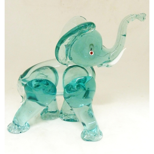 331 - Attributed to Archimede Seguso for Murano Aquamarine-coloured glass figure of an elephant, standing ... 