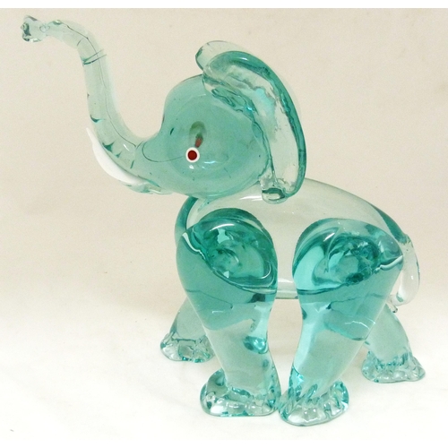 331 - Attributed to Archimede Seguso for Murano Aquamarine-coloured glass figure of an elephant, standing ... 