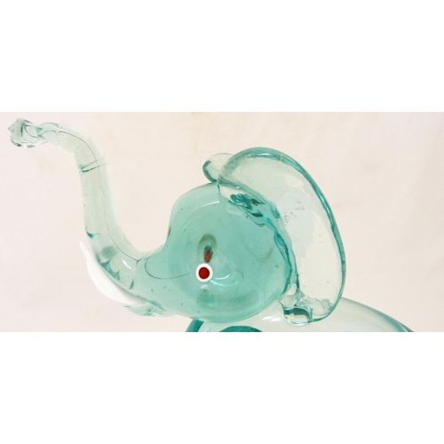 331 - Attributed to Archimede Seguso for Murano Aquamarine-coloured glass figure of an elephant, standing ... 