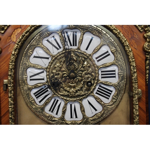 292 - French style brass bound marquetry inlaid column clock, the clock with brass dial having Roman numer... 