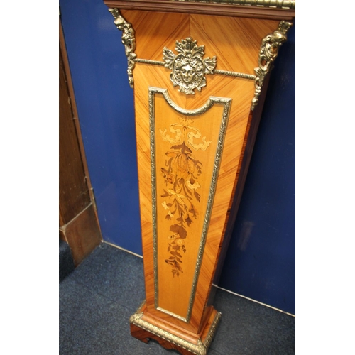 292 - French style brass bound marquetry inlaid column clock, the clock with brass dial having Roman numer... 