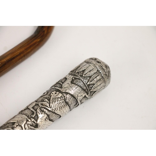 67 - Early 20th century Paragon umbrella, the Indo-Persian white metal handle embossed with repeating exo... 