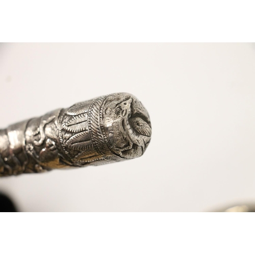 67 - Early 20th century Paragon umbrella, the Indo-Persian white metal handle embossed with repeating exo... 