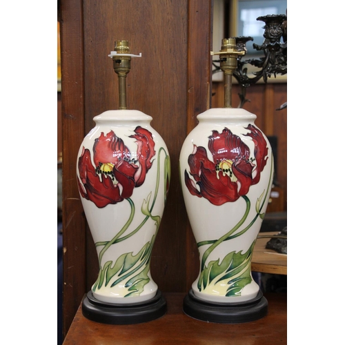 318 - Pair of Moorcroft pottery table lamps in the Dancing Flame pattern, max H48cm.