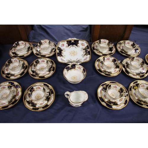 321 - Coalport batwing pattern V.2665 tea set for twelve, decorated in shaped cobalt blue bands, floral sp... 