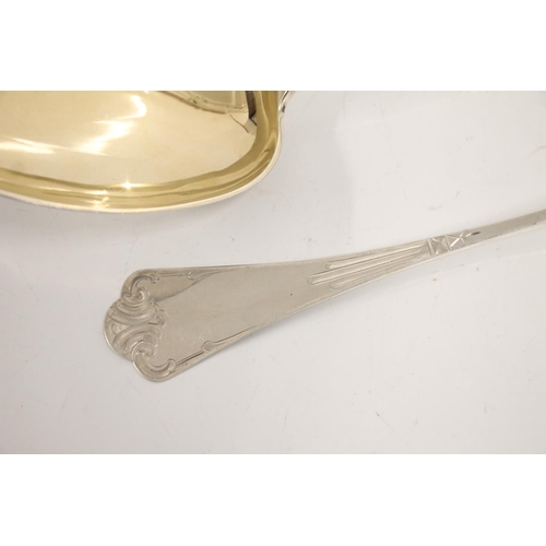 72 - Norwegian .830 standard silver serving spoon, the silver gilt bowl leading to etched silver handle, ... 