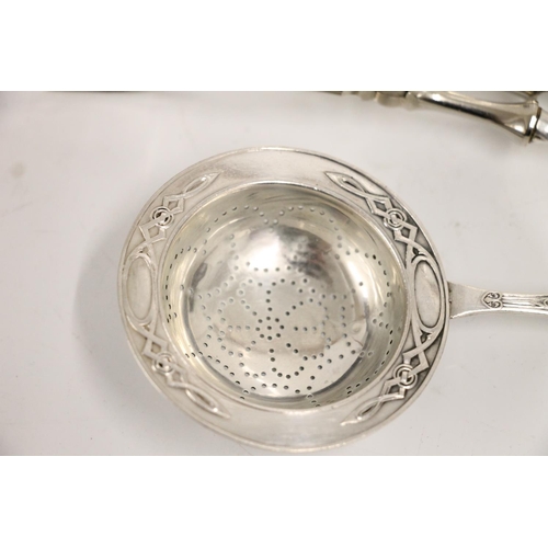 74 - Two Norwegian .830 standard silver pastry tongs, together with an .830 standard silver tea strainer,... 