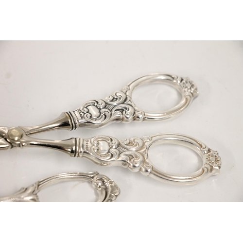 74 - Two Norwegian .830 standard silver pastry tongs, together with an .830 standard silver tea strainer,... 