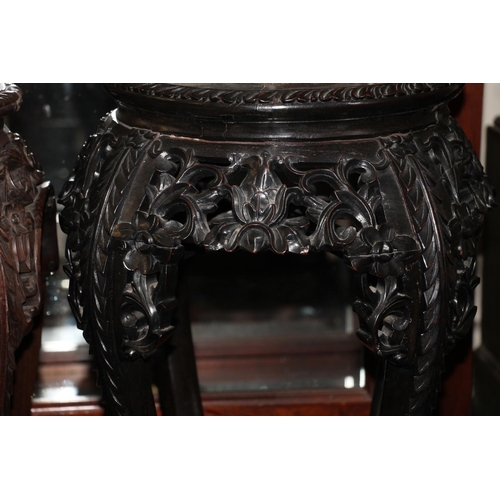 364 - Two Chinese hardwood jardiniere stands, late Qing period, the round tops inset with variegated marbl... 