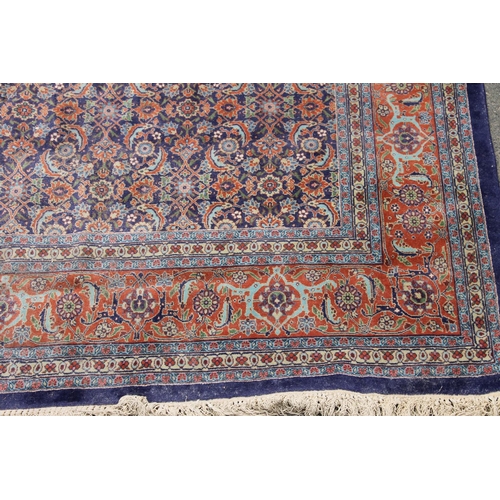 423 - Turkish or Persian Tabriz rug, the central blue ground with repeating polychrome foliate designs bet...