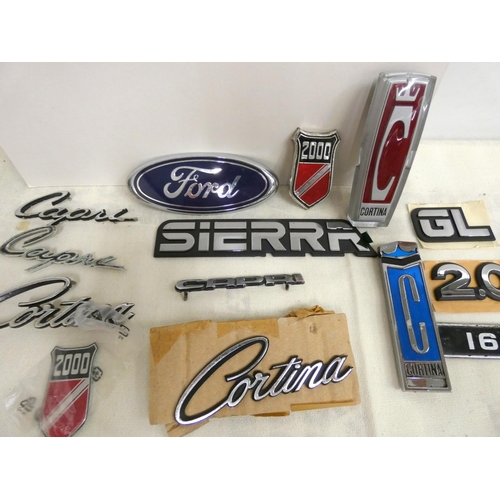 29 - Bag of vintage Ford badges including Capri, Cortina, Ford, Sierra.