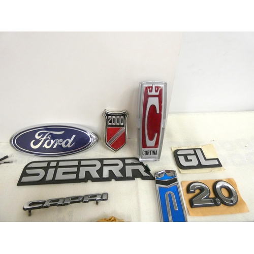 29 - Bag of vintage Ford badges including Capri, Cortina, Ford, Sierra.