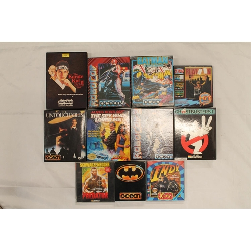 1203 - Box containing Amiga boxed games of movies to include Ghostbusters II, Batman The Cape Crusader, Bat... 