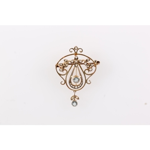 123 - Edwardian 9ct gold Art Nouveau pendant brooch, the round cut aquamarines and seed pearls on a gold o... 