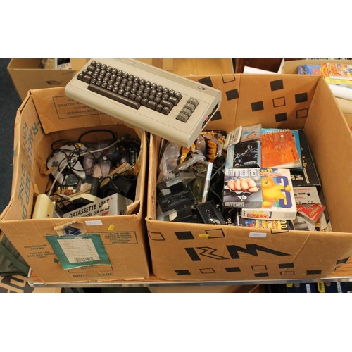 1216 - Two boxes of retro gaming items to include Commodore 64 keyboard, Nintendo 64 control pads, boxed Am... 