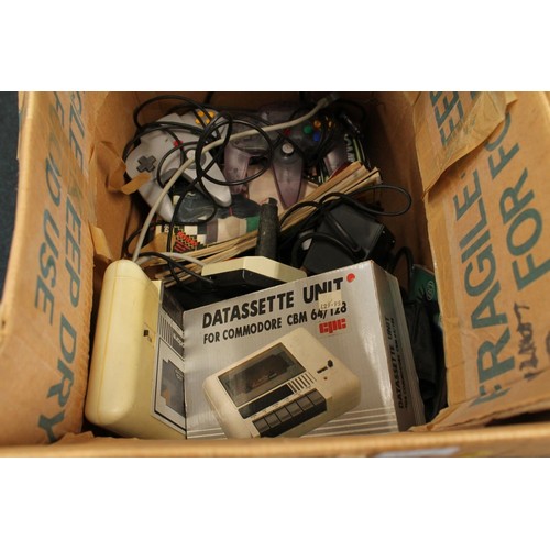 1216 - Two boxes of retro gaming items to include Commodore 64 keyboard, Nintendo 64 control pads, boxed Am... 