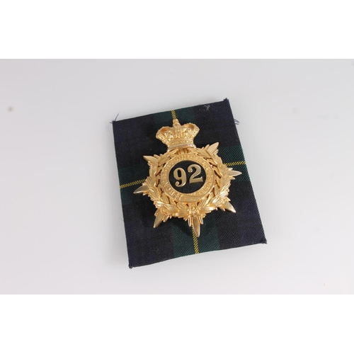 1440 - Gordon Highlanders gilded metal helmet plate badge of crowned wreath and star form with '92' in the ... 