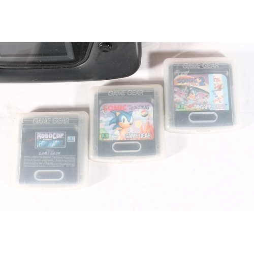 1214 - Sega GameGear boxed with three games to include Sonic the Hedgehog.