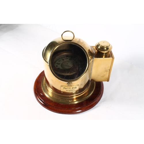 1256 - Ships brass binnacle compass with plaque incised 'PATT 218 No4985 BHS-YG', raised on circular mahoga... 