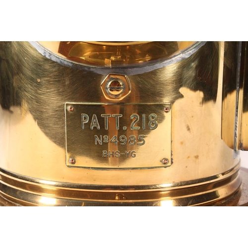 1256 - Ships brass binnacle compass with plaque incised 'PATT 218 No4985 BHS-YG', raised on circular mahoga... 