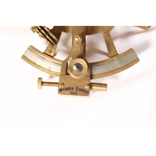 1257 - Stanley of London brass sextant stamped '1880', with magnification lens held in a velvet lined mahog... 