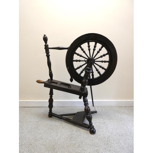 360 - Antique stained oak Scottish spinning wheel, with balustrade columns to the wheel, on turned column ... 