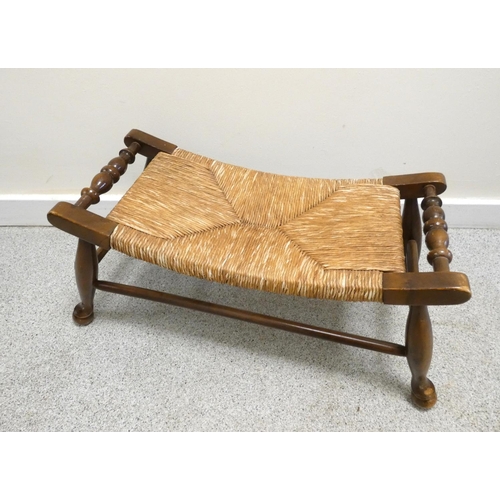 369 - Arts & Crafts style stained beech stool with woven rush top.  Height 28cm, Width 63cm.